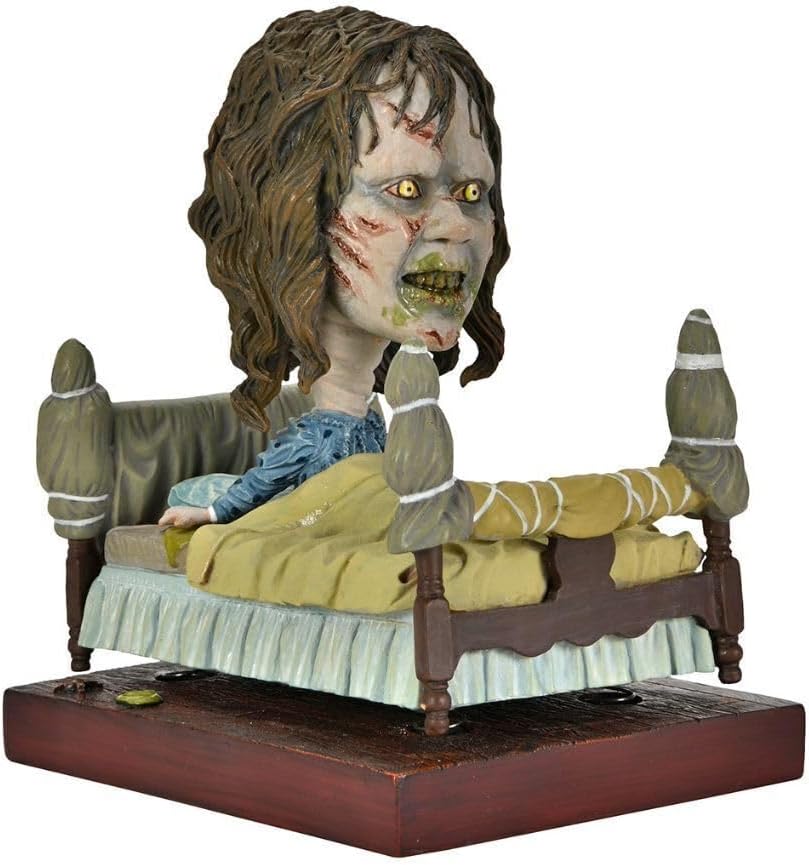 NECA Head Knocker El Exorcista - Regan in Bed (Regan en cama)