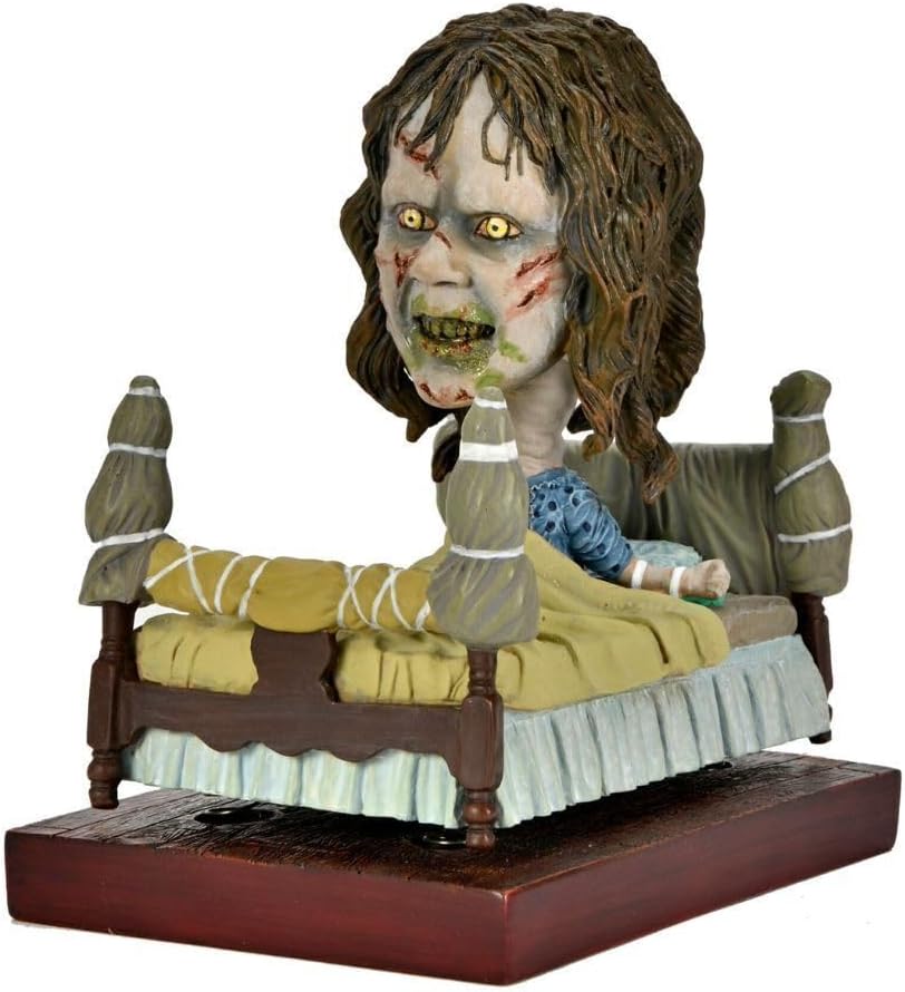 NECA Head Knocker El Exorcista - Regan in Bed (Regan en cama)