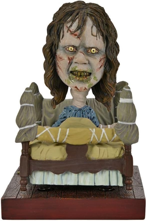 NECA Head Knocker El Exorcista - Regan in Bed (Regan en cama)
